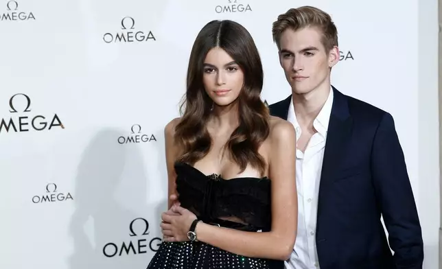 FILE - Model Kaia Gerber, left, and her brother Presley Gerber pose in Paris, Sept. 29, 2017. (AP Photo/Kamil Zihnioglu, File)