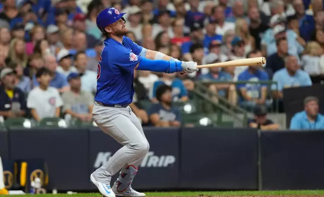 Chicago Cubs' Carson Kelly hits a go ahead two-run double during the ninth inning of a baseball game against the Milwaukee Brewers, Tuesday, Sept. 8, 2026, in Milwaukee. (AP Photo/Aaron Gash)