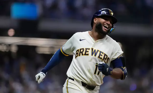 Milwaukee Brewers' Jackson Chourio smiles as he rounds the bases after hitting a two-run home during the ninth inning of a baseball game against the Chicago Cubs, Tuesday, Sept. 8, 2026, in Milwaukee. (AP Photo/Aaron Gash)