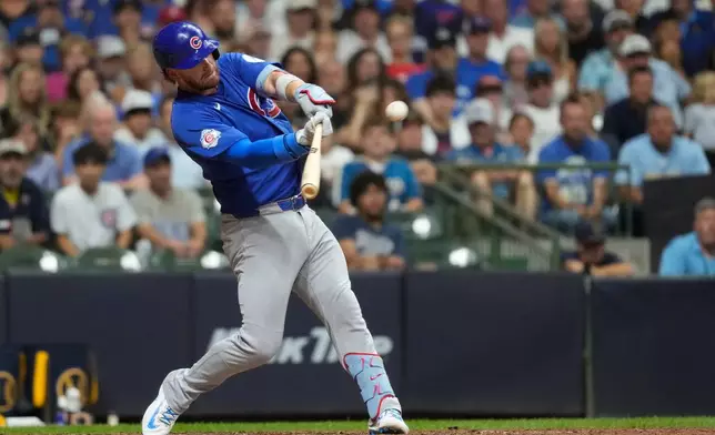 Chicago Cubs' Carson Kelly hits a go ahead two-run double during the ninth inning of a baseball game against the Milwaukee Brewers, Tuesday, Sept. 8, 2026, in Milwaukee. (AP Photo/Aaron Gash)