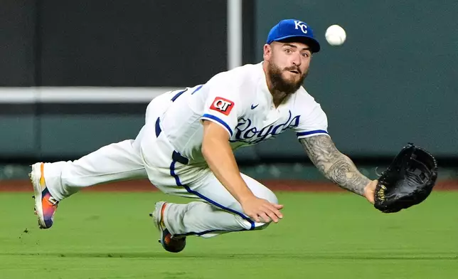 Kansas City Royals center fielder Kyle Isbel catches a sacrifice fly hit by Miami Marlins' Jared Serna to score one run during the sixth inning of a baseball game Wednesday, Sept. 2, 2026, in Kansas City, Mo. (AP Photo/Charlie Riedel)
