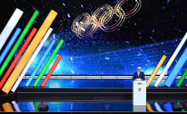 Germany's President Frank-Walter Steinmeier speaks at the extraordinary DOSB General Assembly to select Germany's Olympic bid for 2036, 2040, or 2044, in Baden-Baden, Germany, Saturday Sept. 26, 2026. (Marijan Murat/dpa via AP)