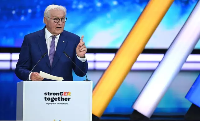 Germany's President Frank-Walter Steinmeier speaks at the extraordinary DOSB General Assembly to select Germany's Olympic bid for 2036, 2040, or 2044 in Baden-Baden, Germany, Saturday Sept. 26, 2026. (Marijan Murat/dpa via AP)