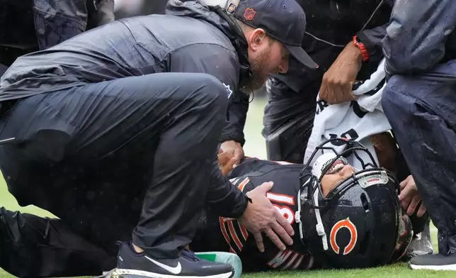 Chicago Bears quarterback Caleb Williams (18) lies on the field during the second half of an NFL football game against the Minnesota Vikings in Chicago, Sunday, Sept. 20, 2026. (AP Photo/Nam Y. Huh)