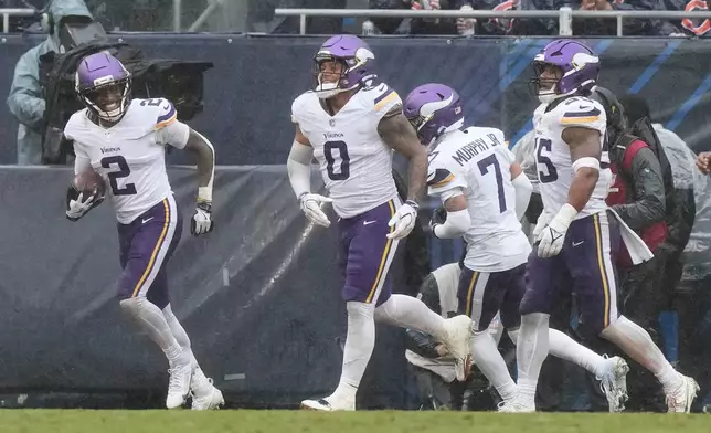 Minnesota Vikings cornerback Isaiah Rodgers (2) smiles after recovering a fumble by the Chicago Bears during the second half of an NFL football game in Chicago, Sunday, Sept. 20, 2026. (AP Photo/Nam Y. Huh)