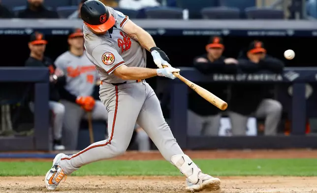 Baltimore Orioles' Pete Alonso hits a home run against the New York Yankees during the seventh inning of the first baseball game of a doubleheader, Friday, Sept. 25, 2026, in New York. (AP Photo/Noah K. Murray)