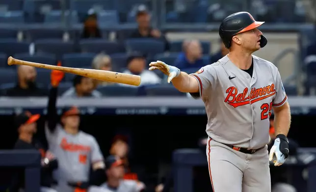 Baltimore Orioles' Pete Alonso tosses his bat after hitting a home run against the New York Yankees during the seventh inning of the first baseball game of a doubleheader, Friday, Sept. 25, 2026, in New York. (AP Photo/Noah K. Murray)