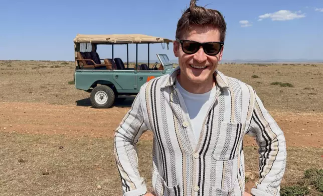 In this photo taken with a smartphone, Loic Amado, founder of Emboo Camp and Era Lab, speaks with The Associated Press during an interview in the Maasai Mara, Kenya, Saturday, Aug. 29, 2026. (AP Photo/Allan Olingo)