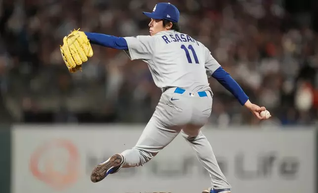 Los Angeles Dodgers pitcher Roki Sasaki throws against the San Francisco Giants during the eighth inning of a baseball game, Friday, Sept. 25, 2026, in San Francisco. (AP Photo/Jeff Chiu)