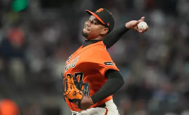 San Francisco Giants pitcher Yunior Marte throws against the Los Angeles Dodgers during the first inning of a baseball game, Friday, Sept. 25, 2026, in San Francisco. (AP Photo/Jeff Chiu)