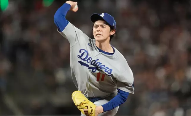 Los Angeles Dodgers pitcher Roki Sasaki throws against the San Francisco Giants during the eighth inning of a baseball game, Friday, Sept. 25, 2026, in San Francisco. (AP Photo/Jeff Chiu)