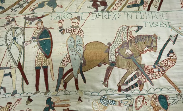 The 70-meter-long Bayeux Tapestry is displayed during a press preview at the British Museum in London after returning to England, following a historic agreement between the UK and France, Monday, Sept. 7, 2026. (AP Photo/Kin Cheung)