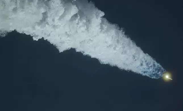 SpaceX's mega rocket Starship makes a test flight from Starbase, Texas, Monday, Sept. 28, 2026. (AP Photo/Eric Gay)