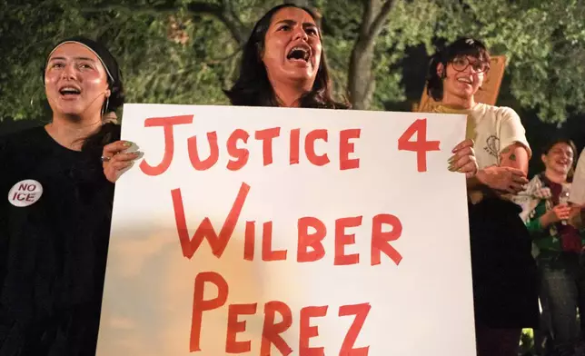 Demonstrators gather in response to the shooting of Wilber Rafael Garces Perez, a Venezuelan man who was shot in his vehicle by an ICE officer the previous day in Austin, Texas, Monday, Sept. 21, 2026. (AP Photo/Joel Angel Juarez)