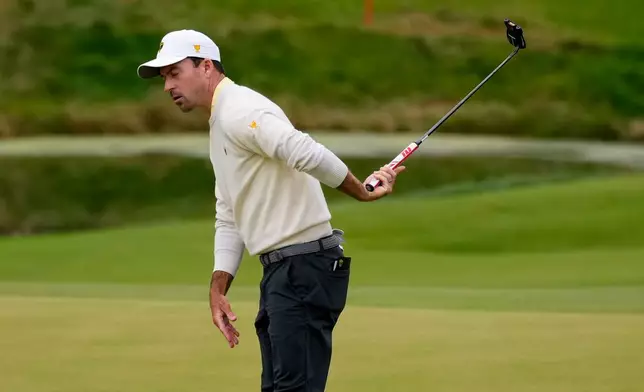 International teams' Nick Taylor, of Canada, reacts to missing his shot on the eighth green against the USA team during the Presidents Cup golf tournament second round foursomes match at Medinah Country Club, Friday, Sept. 25, 2026, in Medinah, Ill. (AP Photo/Chris Carlson)