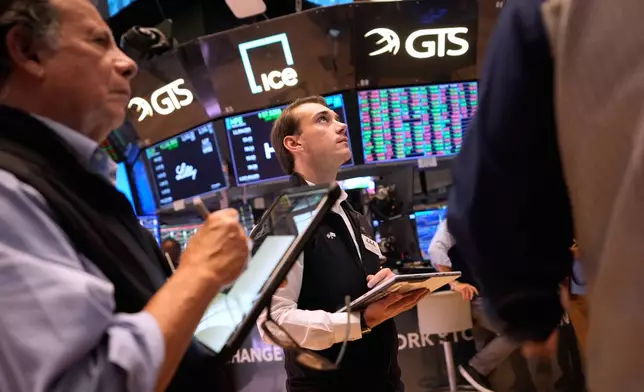 Traders work on the floor at the New York Stock Exchange in New York, Wednesday, Sept. 16, 2026. (AP Photo/Seth Wenig)