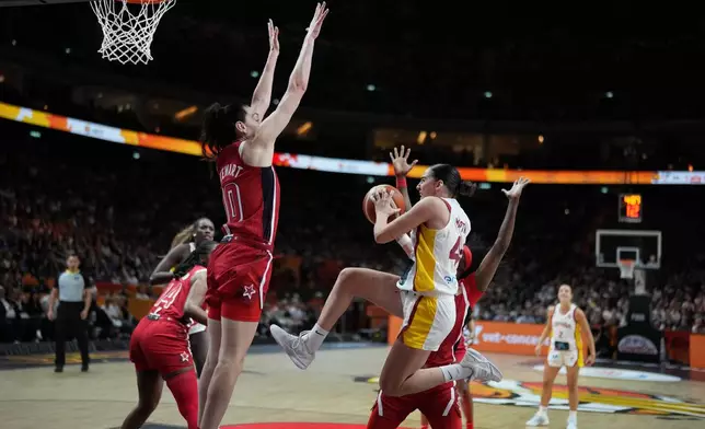 Breanna Stewart, of the United States, guards Spain's Iyana Martín during the Women's Basketball World Cup semifinal match between the United States and Spain in Berlin, Saturday, Sept. 12, 2026. (AP Photo/Ebrahim Noroozi)