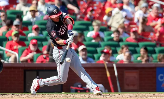 Washington Nationals' Jacob Young hits a single during the fourth inning of a baseball game against the St. Louis Cardinals, Sunday, Sept. 20, 2026, in St. Louis. (AP Photo/Scott Kane)