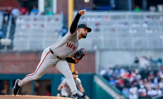 San Francisco Giants pitcher Anthony Molina delivers to an Atlanta Braves batter during the first inning of a baseball game, Monday, Aug. 31, 2026, in Atlanta. (AP Photo/Erik S. Lesser)