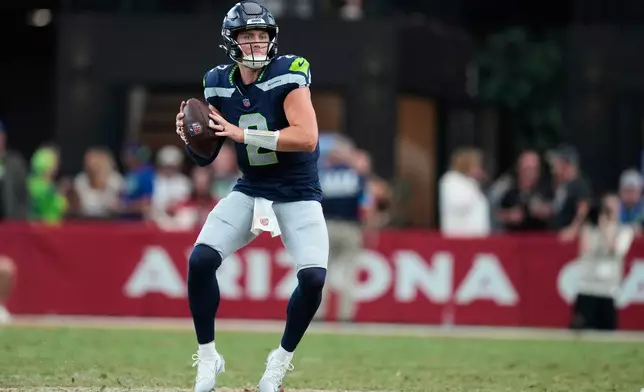 Seattle Seahawks quarterback Drew Lock looks to throw against the Arizona Cardinals during the second half of an NFL football game in Glendale, Ariz., Sunday, Sept. 20, 2026. (AP Photo/Ross D. Franklin)