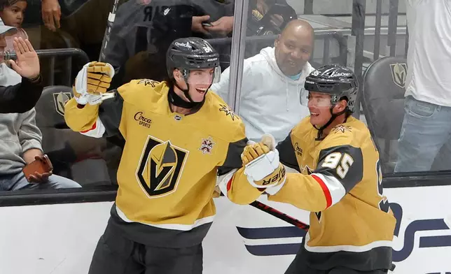 Vegas Golden Knights left wing Trevor Connelly, left, celebrates with left wing Victor Olofsson (95) after scoring against the Chicago Blackhawks during the first period of an NHL hockey game Tuesday, Sept. 29, 2026, in Las Vegas. (Steve Marcus/Las Vegas Sun via AP)
