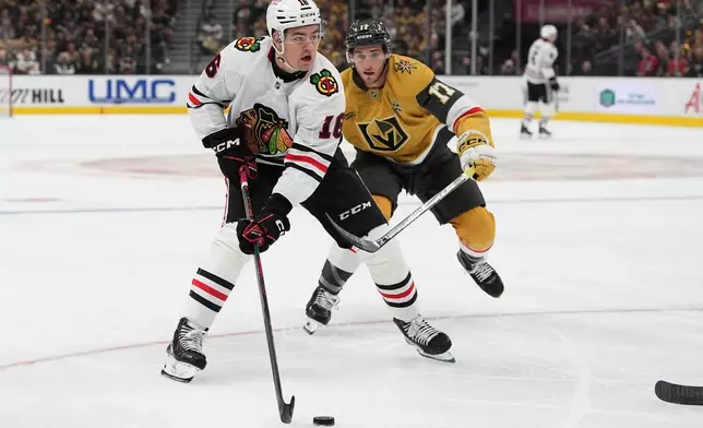 Chicago Blackhawks center Anton Frondell (16) skates against Vegas Golden Knights center Marc Gatcomb (17) during the first period of an NHL hockey game Tuesday, Sept. 29, 2026, in Las Vegas. (AP Photo/John Locher)
