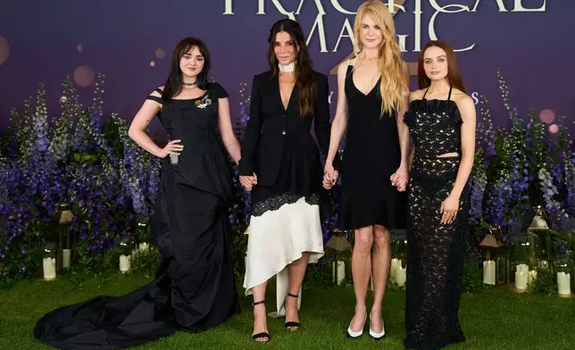 From left, Maisie Williams, Sandra Bullock, Nicole Kidman and Joey King pose for photographers upon arrival at the photo call for the film 'Practical Magic 2' on Thursday, Aug. 27, 2026, in London. (Photo by Scott A Garfitt/Invision/AP)