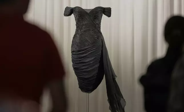 A dress worn by the late Princess Diana and known as the ''Revenge Dress'', designed by Christina Stambolian, is unveiled at Sotheby’s auction house in London, Friday, Sept. 18, 2026, ahead of its Dec. 9 auction in New York, where it is estimated to sell for US$150,000-300,000. (AP Photo/Alastair Grant)
