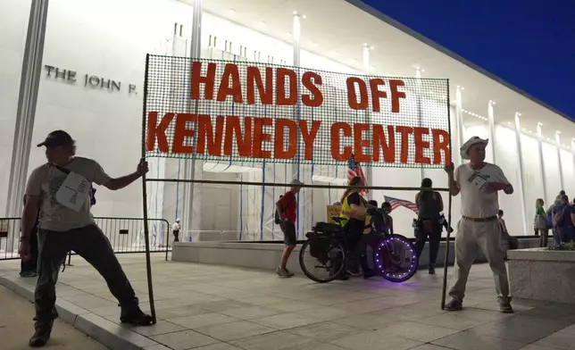 People protest outside the Kennedy Center over the threats by President Donald Trump to demolish the performing arts center, in Washington, Friday, Sept. 18, 2026. (AP Photo/J. Scott Applewhite)