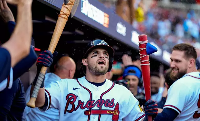 Atlanta Braves' Austin Riley celebrates his three-run home run against the Philadelphia Phillies in the eighth inning during Game 1 of baseball's National League Wild Card Series Tuesday, Sept. 29, 2026, in Atlanta. (AP Photo/Brynn Anderson)