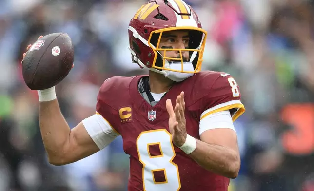 Washington Commanders quarterback Marcus Mariota (8) passes the ball during the first half of an NFL football game against Seattle Seahawks, Sunday, Sept. 27, 2026 in Landover, Md. (AP Photo/Nick Wass)