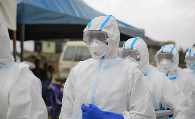Ebola response teams organize a public demonstration to raise awareness about the Ebola virus disease in Beni, North Kivu province, eastern Congo, Tuesday, Sept. 22, 2026. (AP Photo/Sebastien Kitsa Musayi)