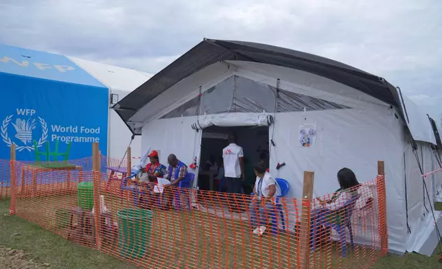 Healthcare workers wait to receive their vaccine at an Ebola vaccination center in Bunia, Ituri province, Congo, Saturday, Sept. 19, 2026. (AP Photo/Dieudonne Dirole)