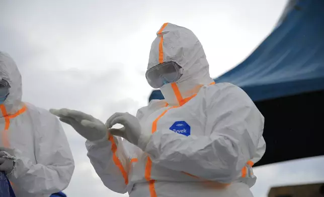 Ebola response teams organize a public demonstration to raise awareness about the Ebola virus disease in Beni, North Kivu province, eastern Congo, Tuesday, Sept. 22, 2026. (AP Photo/Sebastien Kitsa Musayi)