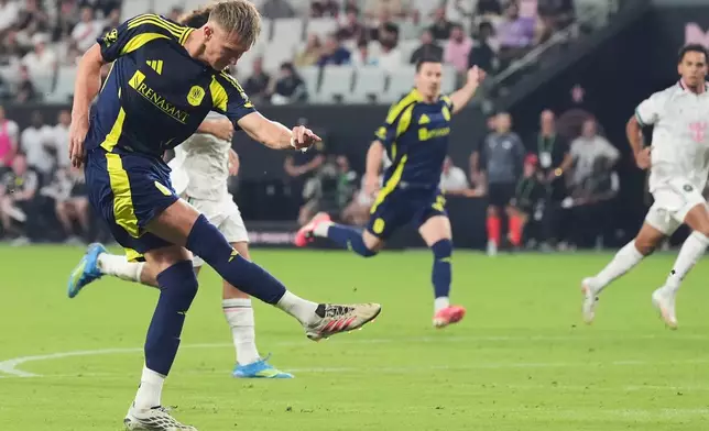 Nashville forward Sam Surridge hits the ball to score during the first half of an MLS soccer match against the Inter Miami Saturday, Sept. 12, 2026, in Miami. (AP Photo/Marta Lavandier)