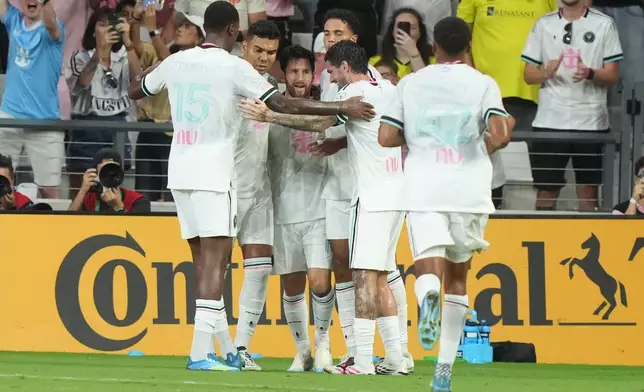 Inter Miami players celebrate Nashville's own goal during the first half of an MLS soccer match Saturday, Sept. 12, 2026, in Miami. (AP Photo/Marta Lavandier)