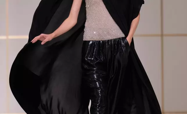 A model wears a creation part of the Giorgio Armani women's Spring-Summer 2027 collection, presented in Milan, Italy, Sunday, Sept. 27, 2026. (AP Photo/Luca Bruno)