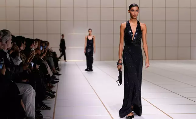 A model wears a creation part of the Giorgio Armani women's Spring-Summer 2027 collection, presented in Milan, Italy, Sunday, Sept. 27, 2026. (AP Photo/Luca Bruno)