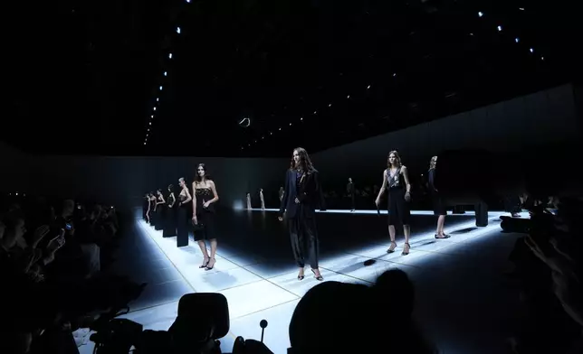 Models wear creations part of the Giorgio Armani women's Spring-Summer 2027 collection, presented in Milan, Italy, Sunday, Sept. 27, 2026. (AP Photo/Luca Bruno)