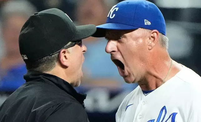 Kansas City Royals manager Matt Quatraro, right, argues with second base umpire Chris Guccione after being ejected from the game during the eighth inning of a baseball game against the Miami Marlins, Tuesday, Sept. 1, 2026, in Kansas City, Mo. (AP Photo/Charlie Riedel)