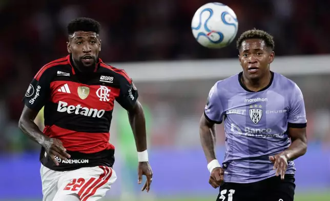 Emerson Royal of Brazil's Flamengo, left, and Emerson Pata of Ecuador's Independiente del Valle eye the ball during a Copa Libertadores quarterfinal second leg soccer match in Rio de Janeiro, Thursday, Sept. 17, 2026. (AP Photo/Bruna Prado)