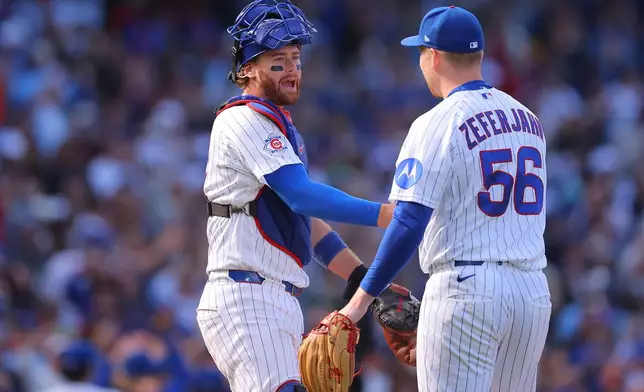Chicago Cubs' Carson Kelly, left, and Ryan Zeferjahn (56) celebrate after a baseball game against the Miami Marlins, Thursday, Sept. 24, 2026, in Chicago. (AP Photo/Melissa Tamez)