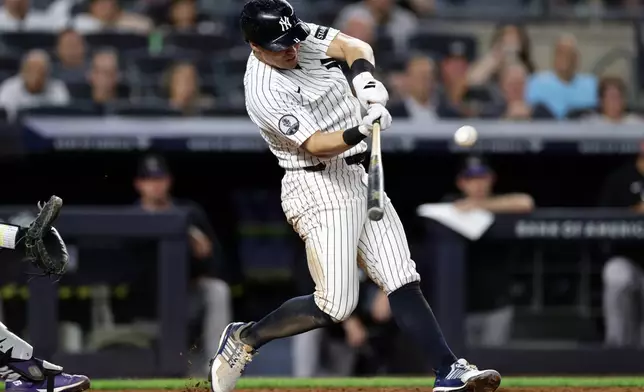 New York Yankees' Anthony Volpe hits a grand slam during the seventh inning of a baseball game against the Colorado Rockies, Thursday, Sept. 10, 2026, in New York. (AP Photo/Adam Hunger)