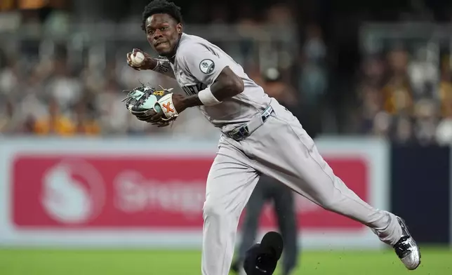 New York Yankees second baseman Jazz Chisholm Jr. throws to first for the out on San Diego Padres' Fernando Tatis Jr. during the third inning of a baseball game Friday, Sept. 4, 2026, in San Diego. (AP Photo/Gregory Bull)