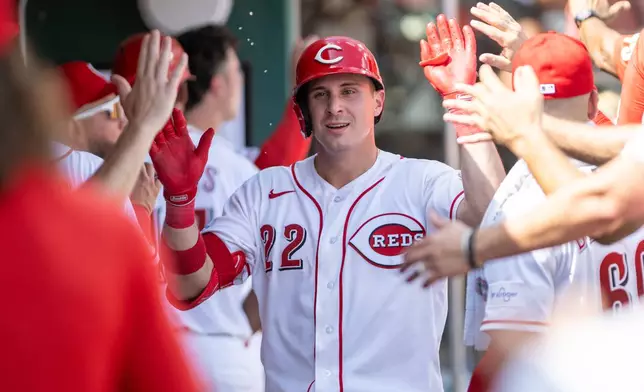 Cincinnati Reds left fielder J.J. Bleday (22) celebrates in the dugout after hitting a 2two-run home run during the seventh inning of a baseball game between the Cincinnati Reds and the San Diego Padres, Wednesday, Sept. 2, 2026, in Cincinnati. (AP Photo/Tony Wagner)