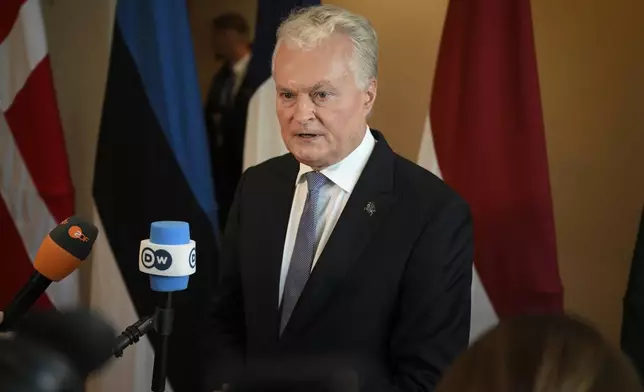 President of Lithuania Gitanas Nauseda speaks with members of the media during the European Arctic Summit in Rovaniemi, Finland, Monday, Sept. 14, 2026. (Jouni Porsanger/Lehtikuva via AP)