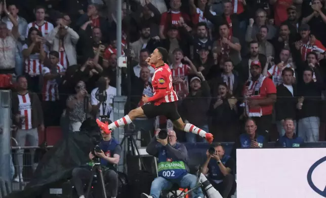 PSV's Sergino Dest celebrates after scoring his side's first goal during the Champions League opening phase soccer match between PSV and Shakhtar in Eindhoven, Netherlands, Thursday, Sept. 10, 2026. (AP Photo/Patrick Post)