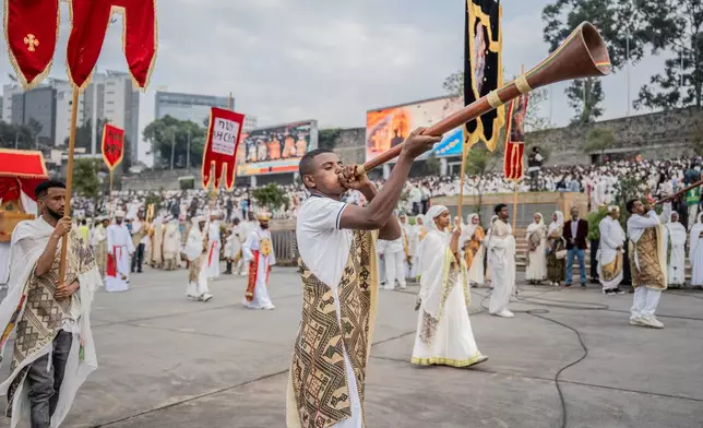 Members of an Orthodox choir perform during celebrations for the Orthodox holiday of Meskel, an annual holiday celebrating the discovery of the True Cross in the fourth century by the Roman Empress Helena, in Addis Ababa, Ethiopia, Saturday, Sept. 26, 2026. (AP Photo/Amanuel Sileshi)