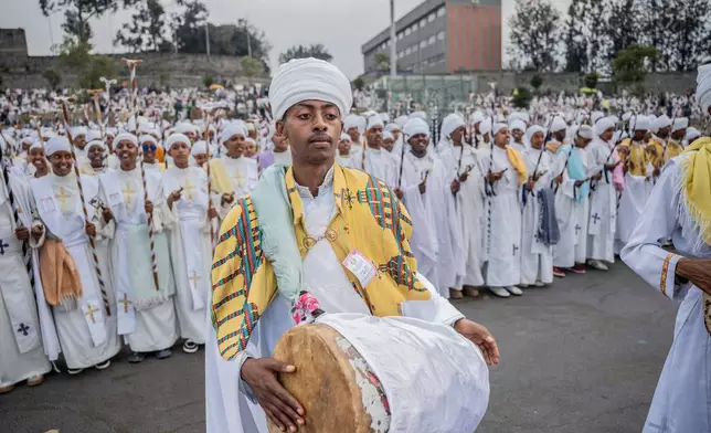 Members of an Orthodox choir perform during celebrations for the Orthodox holiday of Meskel, an annual holiday celebrating the discovery of the True Cross in the fourth century by the Roman Empress Helena, in Addis Ababa, Ethiopia, Saturday, Sept. 26, 2026. (AP Photo/Amanuel Sileshi)