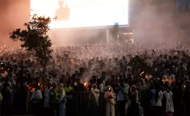 People chant during celebrations for the Orthodox holiday of Meskel, an annual holiday celebrating the discovery of the True Cross in the fourth century by the Roman Empress Helena, in Addis Ababa, Ethiopia, Saturday, Sept. 26, 2026. (AP Photo/Amanuel Sileshi)